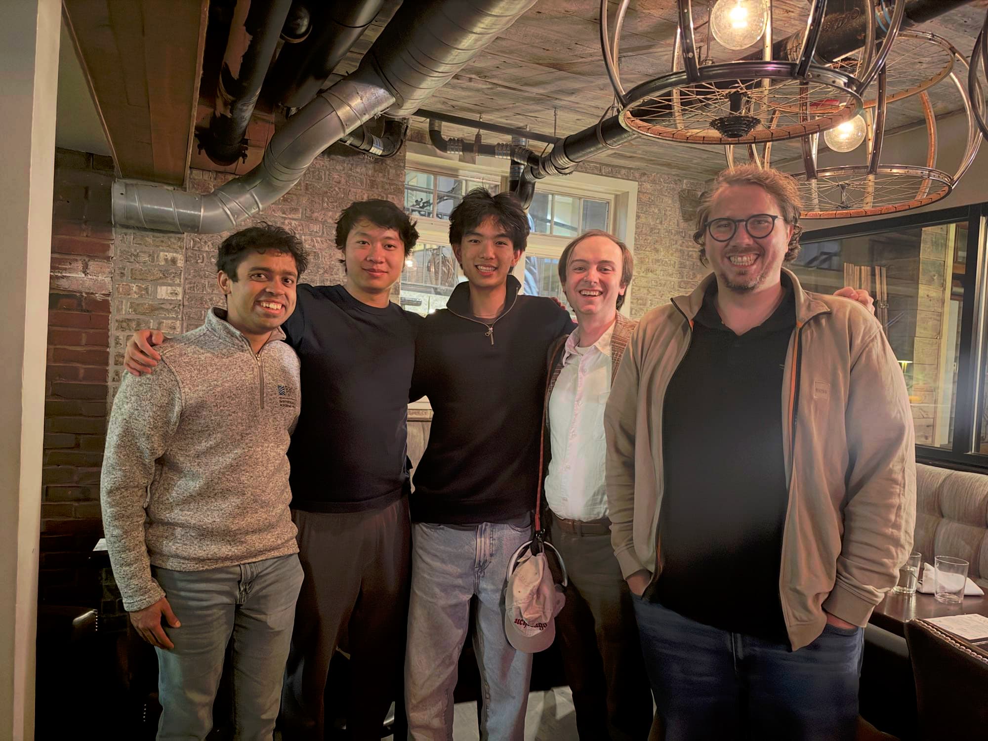 The Extropic team and Research Corner members gathered for a group photo after dinner